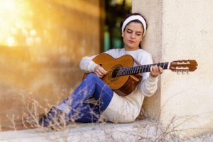 lady playing guitar
